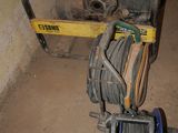 a stack of wires on a cart in a room