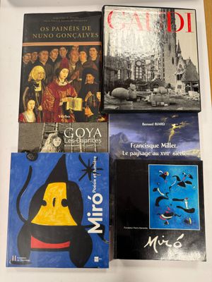 several books are sitting on a table next to each other