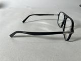 a pair of glasses sitting on a white surface