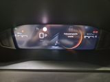 the dashboard of a car with a digital display on it