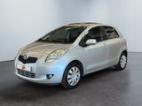 a picture of a silver toyota yaris parked in a showroom