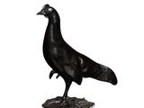 statue of a black bird on a white background with a reflection