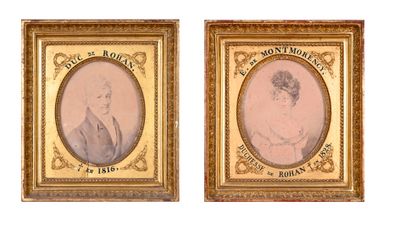 two framed portraits of a man and a woman in formal clothing