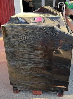 a black box that is sitting on a pallet