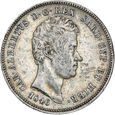 Gros plan sur une pièce de monnaie portant le visage d'un homme
