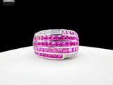 an image of a pink and white diamond ring on a white surface