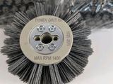 a close up of a brush on a white surface