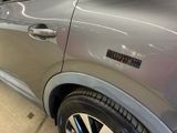 a close up of a car door with a sticker on it