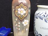 two vases sitting next to each other on a table