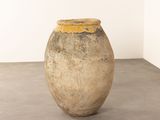 a vase that is sitting on the floor in a room