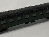 a black train car sitting on a white surface
