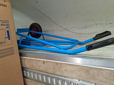 two blue hoses sitting on the side of a truck