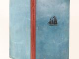 a blue book with a picture of a sailboat on it