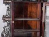 a wooden cabinet with a mirror in it