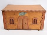 a small wooden chest with a door on the front