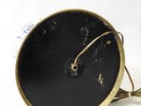 a black and gold clock sitting on top of a white table