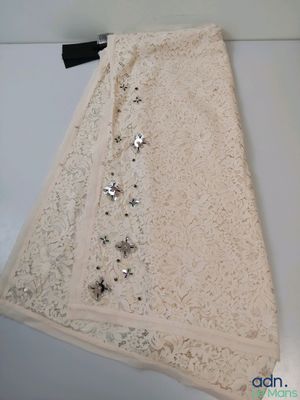 the skirt is made of lace and has stars on it