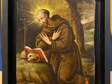 an image of a painting of a monk reading a book with a skull in the foreground