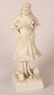 statue of a woman with a basket of flowers in her hand