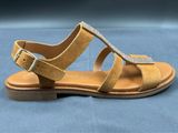 a close up of a pair of sandals on a blue surface