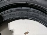 a close up of a tire with a hole in the tire