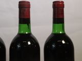 three bottles of wine sitting next to each other on a table