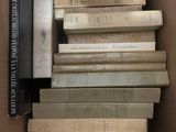 a box full of books that are stacked on top of each other