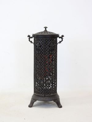 a small black candle holder on a white background