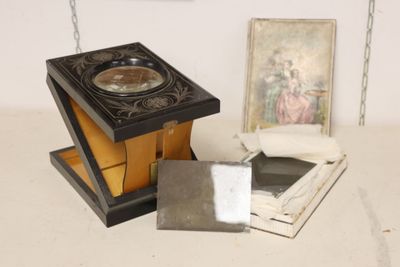 a picture of a clock and a picture of a woman on a shelf