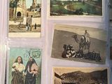 a lot of old postcards that are on the table