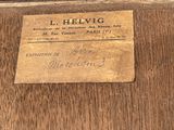 a label on a piece of wood that says l helvig