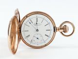 une montre de poche ancienne avec un boîtier en or et des chiffres romains