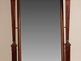an image of a mirror with a wooden frame and a lion head on it