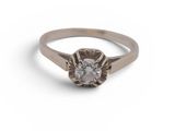 a close up of a diamond ring on a white background