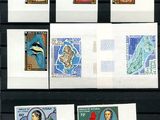 nine different stamps on a black board with a picture of a woman