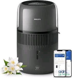 Le purificateur d'air Philips se trouve à côté d'un iPhone et d'une fleur