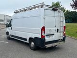 a white van that is parked in a parking lot