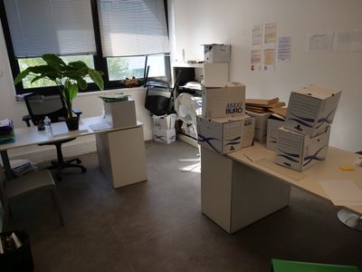 a desk with a bunch of boxes on top of it