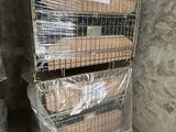 two cages with boxes on top of them in a room