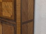 a wooden cabinet with two drawers and a door