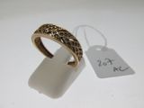 a close up of a ring on a white surface with a price tag