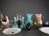 a lot of glass vases that are sitting on a table