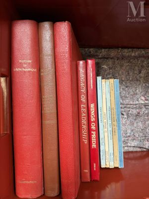 many books that are on a shelf in the room