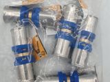 six blue and silver hoses in a plastic bag on a white surface