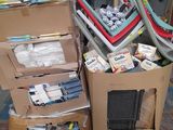 a pile of assorted items sitting on top of a carton