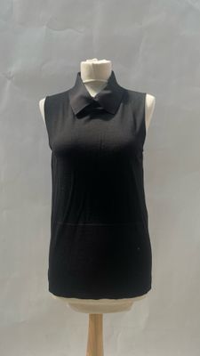 black sleeveless top on a mannequin base with a bow tie