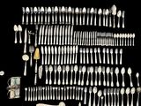 a lot of spoons and spoon spoons on a table