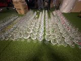 many empty wine glasses lined up on the floor