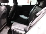 the back seats of a car are empty and the passenger seat is empty