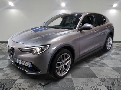 the grey alfa suv is parked on a checkered tile floor